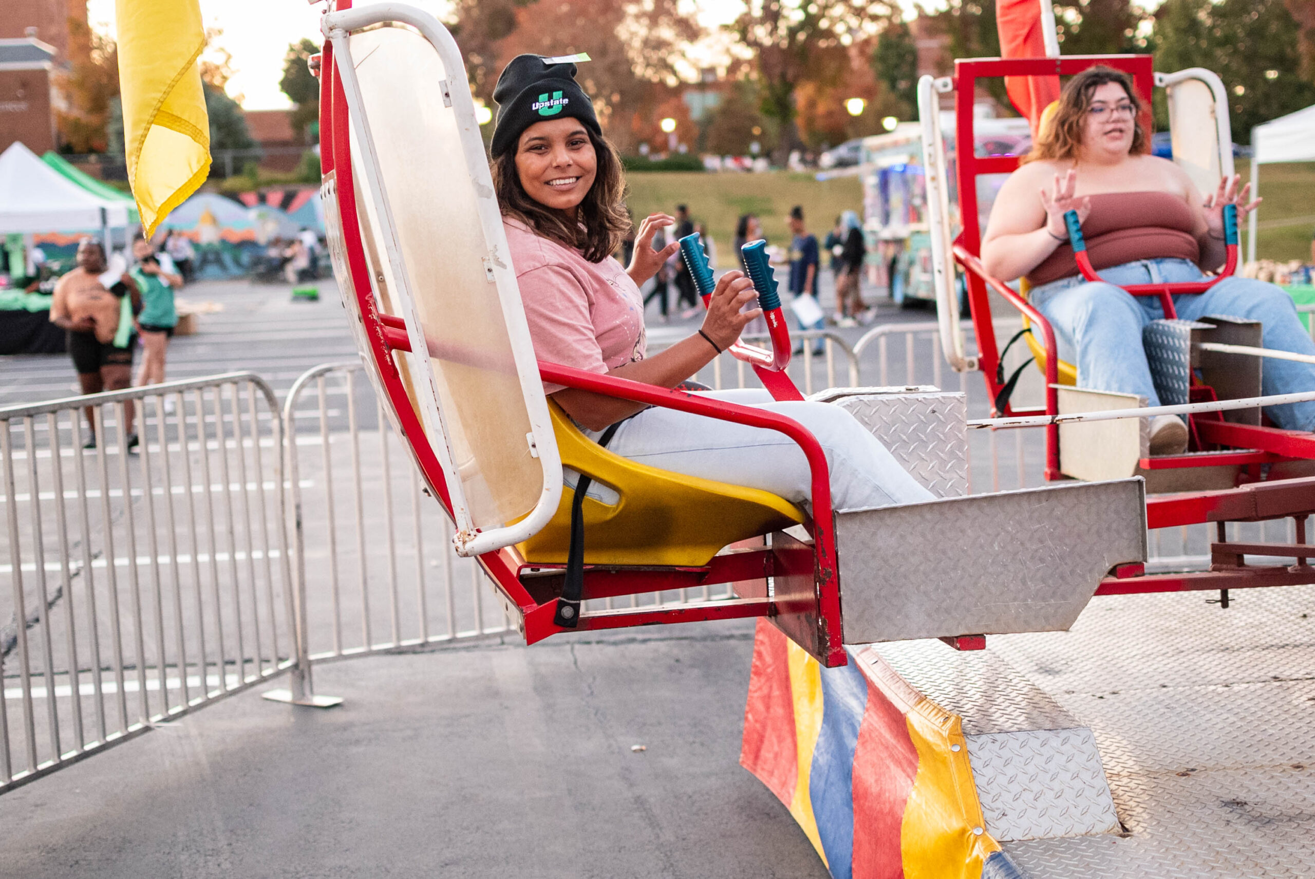 Students in a carnival ride at Rocktoberfest on the USC Upstate campus