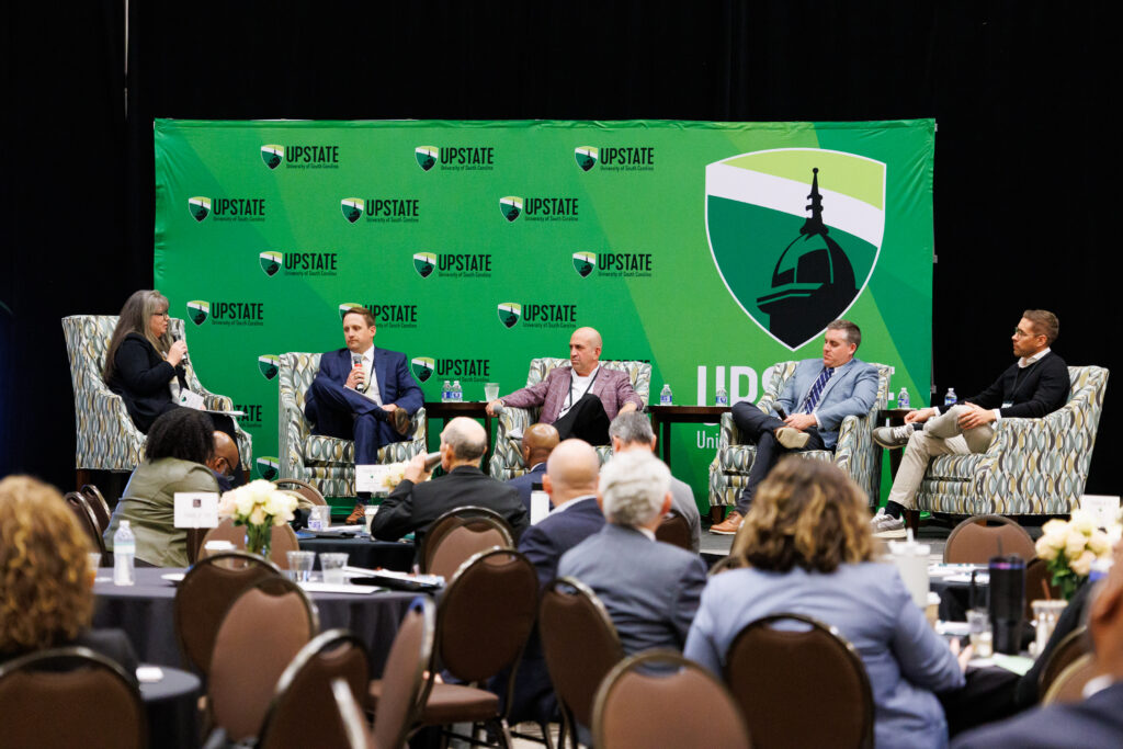 Speakers on stage for a panel discussion of AI at the Upstate Talent Forum