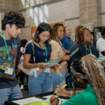 Students at orientation signing in