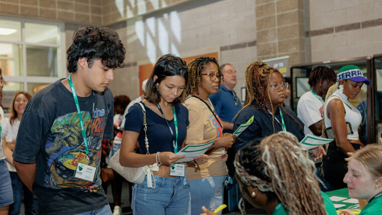 Students at orientation signing in