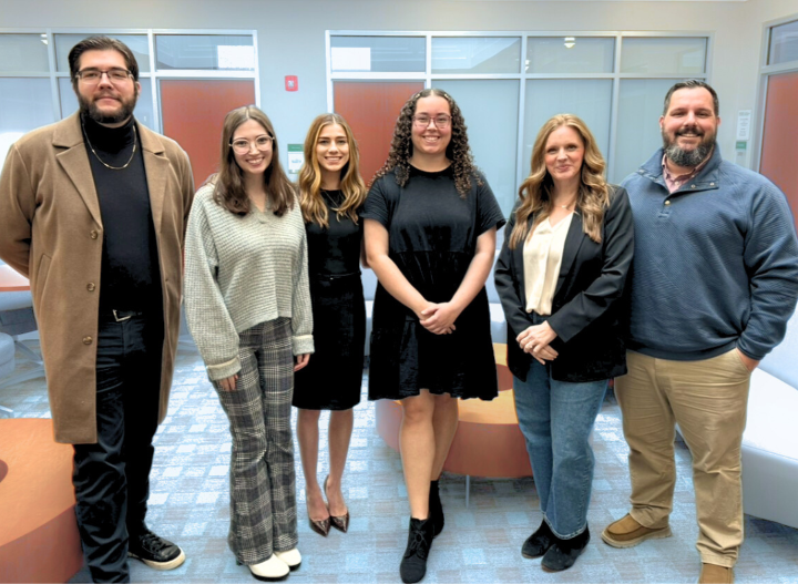 Marketing students preparing for presentations to community partners