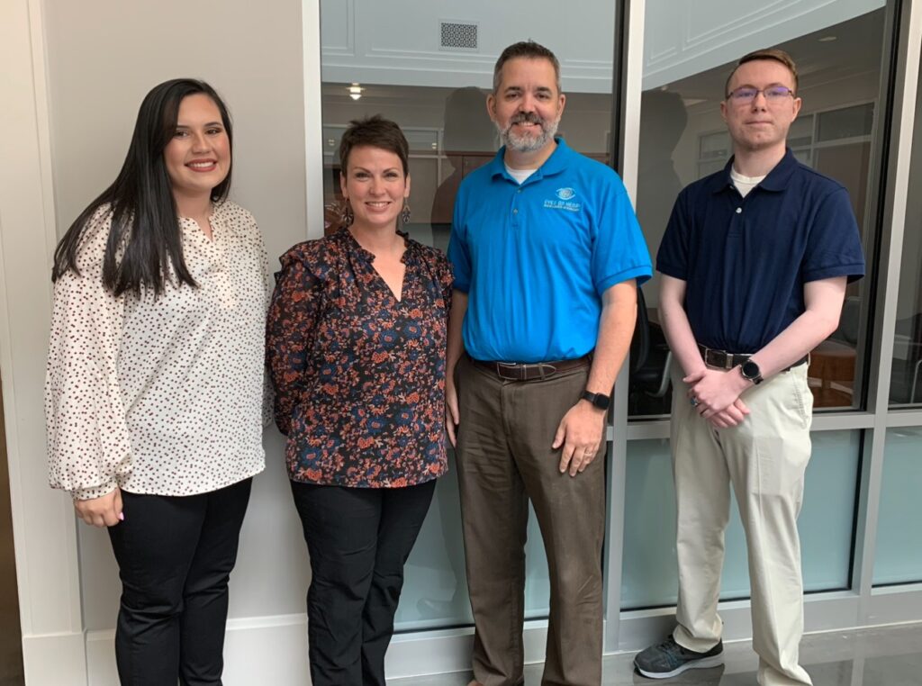 Group photo taken with students and the staff of Eyes on Henry.